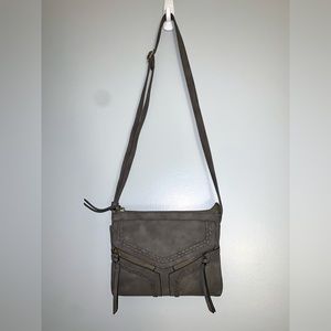 Charming Charlie’s cross body bag. Gray slim purse. Slightly used. Adjustable.